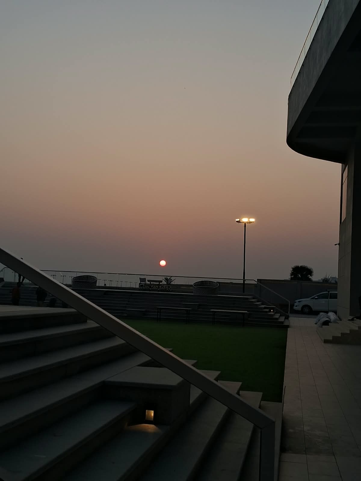the sun dropping behind the steps